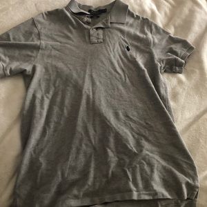 A grey Polo short sleeve shirt with a collar.